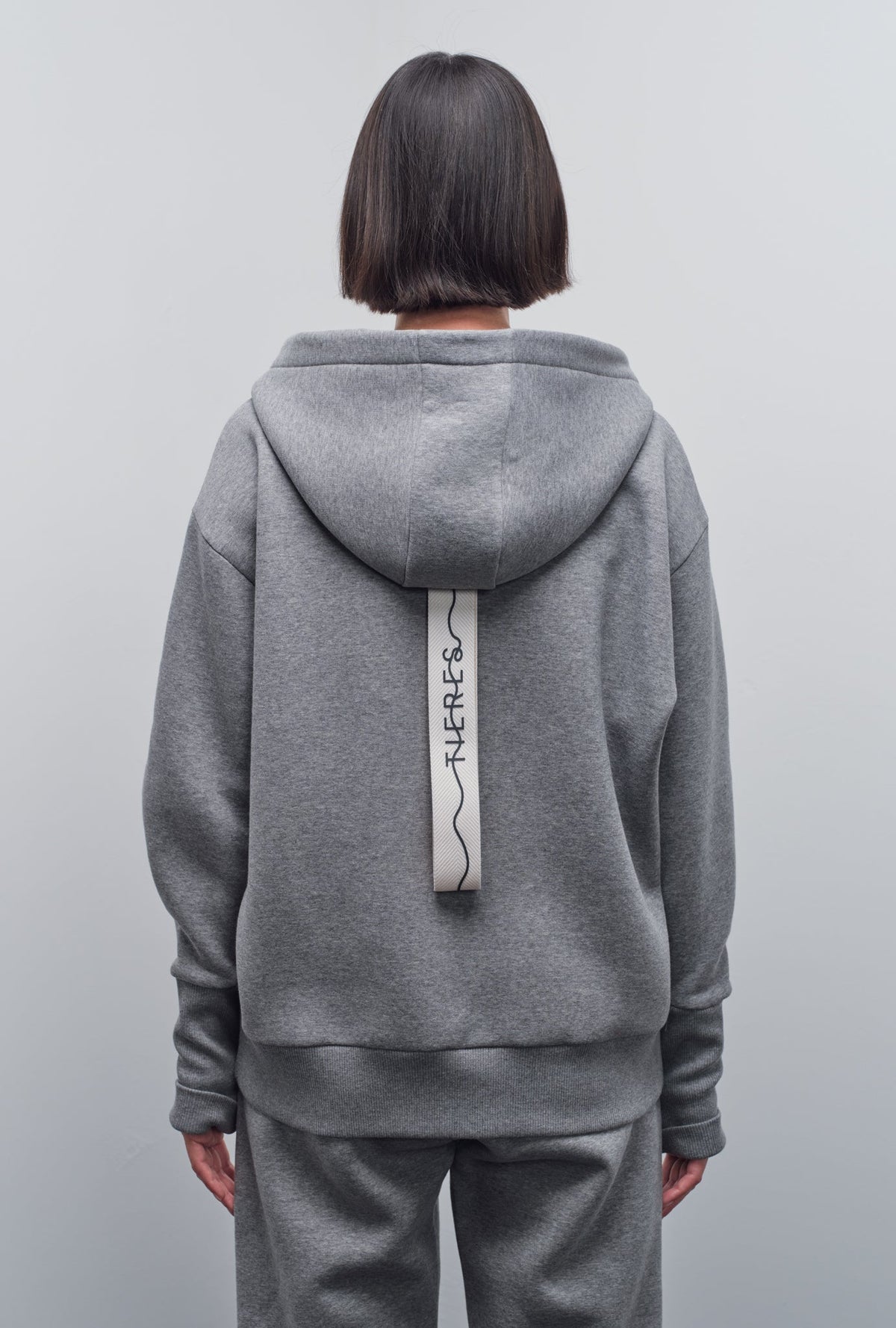 SOLIN SIGNATURE ZIP-UP HOODIE